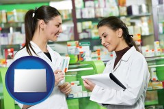 colorado map icon and two pharmacists in a drug store